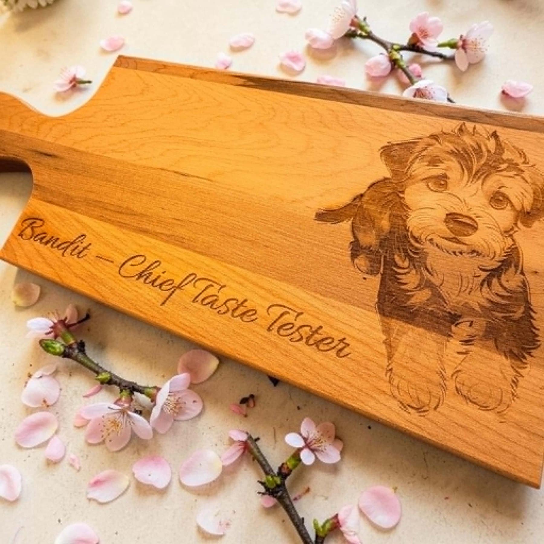 A cherry board engraved with a portrait of a dog